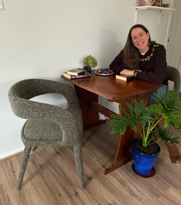 Catherine Kerr sitting at her desk