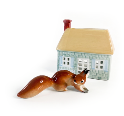 Ceramic squirrel and miniature house
